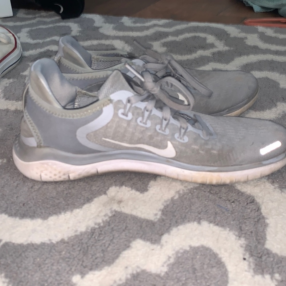 Gray and white Nike size US eight